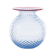 Clear glass vase with a textured design on a white background